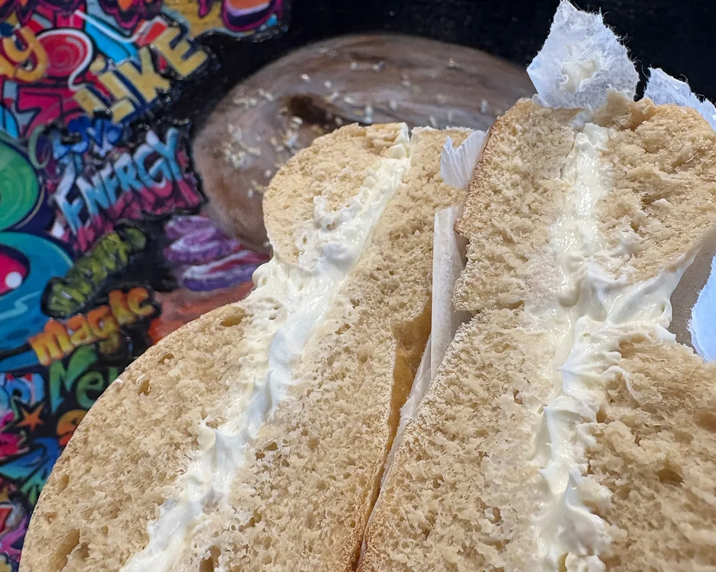 A New York-style bagel split and spread with house-made cream cheese at B's Bagels