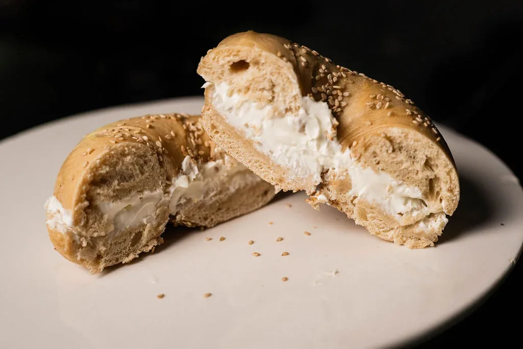 A fresh sesame bagel with house-made cream cheese